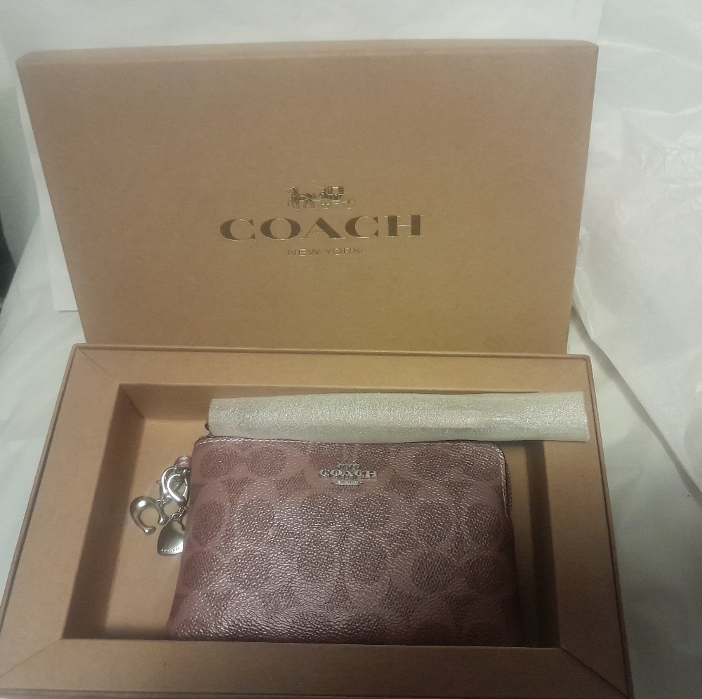 New Coach Wristlet In Shimmery Pink Sign.With Charms NWT In Gift Box 💗